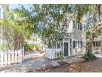 Charming home featuring a cozy front yard and white picket fence at 36 Bogard St, Charleston, SC 29403