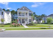 Charming two-story home with double porches and beautifully landscaped front yard at 3636 Goodwater St, Mount Pleasant, SC 29466
