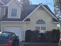 Charming two-story home with attached garage, manicured bushes, and appealing architectural details at 110 Greyson Cir, Goose Creek, SC 29445