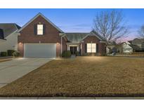 Charming single-Gathering home with well-maintained lawn and attached two-car garage at 1739 Waterbrook Dr, Charleston, SC 29414