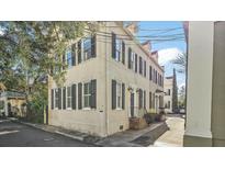 Charming multi-story home with classic architectural details and black shutters at 7 West St # C, Charleston, SC 29401