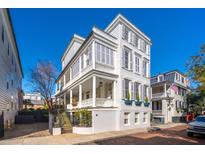 Charming three-story Charleston-style home with double porches and gray shutters at 11 Church St, Charleston, SC 29401