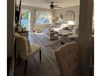 Inviting living room with an open floorplan, a large window, and a comfortable couch at 116 Lyle Rd, Goose Creek, SC 29445