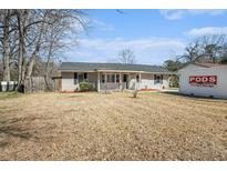 Charming single-story home with a cozy front porch and well-maintained landscaping at 141 Cannon Ave, Goose Creek, SC 29445