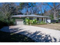 Charming single story home with stone driveway and beautiful landscaping at 1763 Three Oaks Ave, Charleston, SC 29407