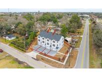 Aerial view of newly built townhomes featuring modern design and individual driveways in a well landscaped neighborhood at 2193 Helm Ave, North Charleston, SC 29405