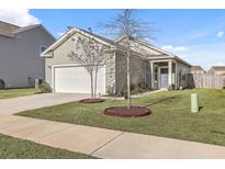 Charming single-Gathering home featuring a two-car garage, well-kept lawn, and inviting front porch at 414 Pender Woods Dr, Summerville, SC 29486