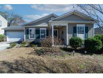Charming single-story home with a well-manicured front yard and inviting entrance at 7919 New Ryder Rd, North Charleston, SC 29406