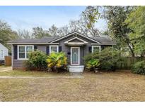 Charming single story home with well-maintained landscaping and inviting front entrance at 1195 Marquis Rd, North Charleston, SC 29405