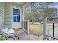 Inviting front porch with seating area, perfect for enjoying the outdoors at 1600 Larry St, North Charleston, SC 29406