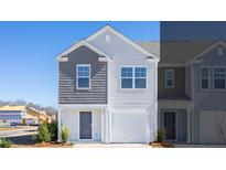 Charming two-story home with gray and white siding and an attached garage, perfect for a new Gathering at 210 Blue Haw Dr, Moncks Corner, SC 29461
