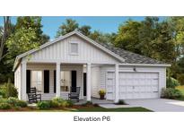 Charming single-story home featuring a covered porch, attached garage, and professionally landscaped yard at 103 Pen Shell St, Summerville, SC 29485