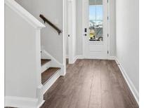 Inviting entryway with wood-look floors and staircase leads into the beautiful home at 363 Chapman Cir, Goose Creek, SC 29445