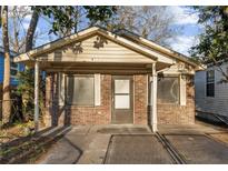 Charming single-story home with brick facade and covered front porch at 4928 Gaynor Ave, North Charleston, SC 29405