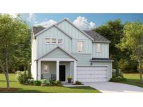 Charming two-story home featuring a covered entry, an attached two car garage, and professionally landscaped yard at 605 Red Monarch Way, Moncks Corner, SC 29461