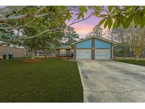 Charming single-Gathering home with a well-maintained lawn, two-car garage, and inviting curb appeal at 105 New Ct, Summerville, SC 29483