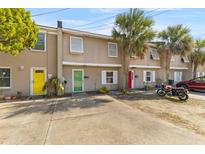 Charming townhomes with colorful doors, lush palm trees, and convenient parking in a desirable location at 126 Drake St, Charleston, SC 29403