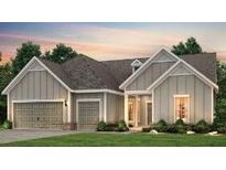 Charming one-story home featuring a two-car garage, gabled roof, and welcoming front porch at 2054 Cousteau Ct, Johns Island, SC 29455