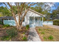 Charming cottage-style home with a welcoming front porch and a well-maintained yard at 4509 Rugheimer Ave, North Charleston, SC 29405