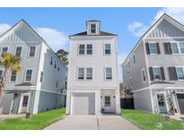Charming three-story home with a one car garage and a well-manicured lawn in a friendly neighborhood at 1002 Carmela Ct, North Charleston, SC 29405