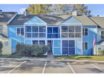 Charming, brightly colored townhome featuring screened porches and convenient parking at 105 Peacock Pl, Summerville, SC 29485