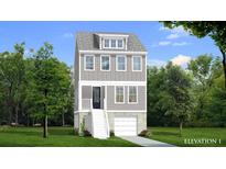 Charming three-story home with a gray exterior, white trim, a front-facing garage, and well-manicured landscaping at 1082 Glenshaw St, North Charleston, SC 29405