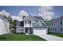 Charming two-story blue home with a white garage door and second story balcony at 137 Seaton Street, Summerville, SC 29486