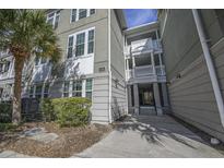 Stylish multi-story building features classic architectural details and lush landscaping at 1622 Telfair Way, Charleston, SC 29412