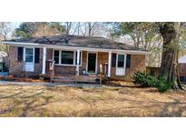 Charming brick home with a cozy front porch and well-maintained landscaping at 340 Annette Dr, Goose Creek, SC 29445