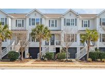 Beautiful townhome exteriors with covered parking and inviting entrances at 1614 Prince Edward St, Mount Pleasant, SC 29466