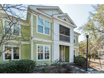 Two-story townhome with light green siding, white trim, and a screened in porch at 1718 Chatelain Way, Mount Pleasant, SC 29464