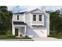 Charming two-story home with light-blue siding, white trim, a dark front door, and an attached garage at 317 Pine Crest View, Summerville, SC 29486