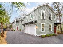 Charming two-story home with a two car garage and lovely landscaping at 493 Woodland Shores Rd, Charleston, SC 29412
