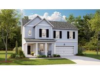 Charming two-story home featuring a well-manicured lawn, a welcoming front porch, and a two-car attached garage at 548 Richfield Way, Summerville, SC 29486