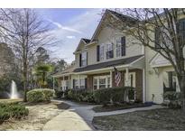 Charming two-story home with well-maintained landscaping and a welcoming front porch at 901 Elm Hall Cir, Summerville, SC 29483