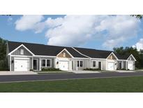Charming townhomes featuring attached garages, neutral color schemes, and professionally landscaped yards at 909 Dusk Dr, Summerville, SC 29486