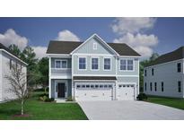 Charming two-story home with a three car garage and a welcoming front porch at 130 Seaton Street, Summerville, SC 29486