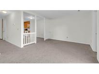 Bright living room featuring neutral carpet and an opening to the kitchen at 4722 Whitwil Blvd, North Charleston, SC 29418