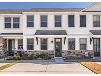 Charming townhouse with stone accents, light trim, and black door awning at 5146 Park Creek Ave, North Charleston, SC 29418