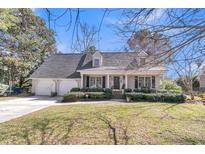 Charming single-story home with a manicured front lawn and a two-car garage at 726 Gypsy Ln, Mount Pleasant, SC 29464