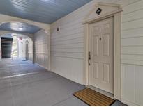 A view of the unit's entrance from the outside hallway, showing the unit number and the door with secure lock at 1505 Basildon Rd, Mount Pleasant, SC 29466