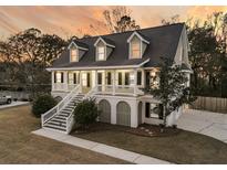 Charming two-story home with traditional architecture, and manicured landscaping at 2755 Fox Trot Rd, Charleston, SC 29414
