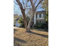 Charming two-story home with landscaped front yard and traditional architectural details at 3149 Linksland Rd, Mount Pleasant, SC 29466