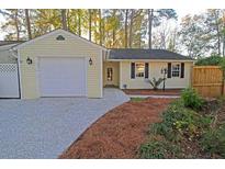 Charming home with attached garage, featuring a well-maintained yard and traditional design at 6 Duchess Ct, Summerville, SC 29485