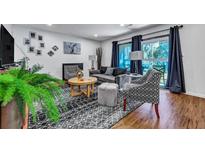 Cozy living room with plush seating, elegant decor, and lots of natural light at 87 Ashley Hall Plantation Rd # 108, Charleston, SC 29407