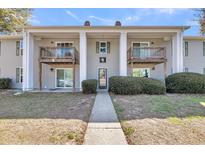 Inviting condo with a charming walkway leading to the entrance and private balconies at 1402 Camp Rd # 8B, Charleston, SC 29412