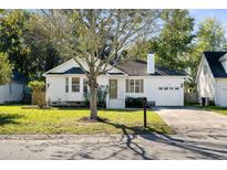 Charming single-story home featuring a well-maintained lawn, attached garage, and lovely curb appeal at 1589 Kentwood Cir, Charleston, SC 29412