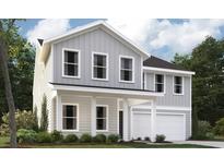 Charming two-story home with light gray siding, white trim, a covered porch, and a two-car garage at 613 Cottage Landing Dr, Summerville, SC 29485