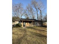 Charming single-story brick home with a cozy front porch and mature trees at 6983 Vista Ct, North Charleston, SC 29406