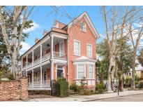Charming two-story home with a spacious porch and bay window at 1 Percy St, Charleston, SC 29403